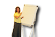 A picture of a woman writing something on a white board